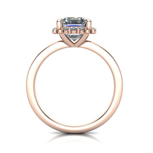 Mckenna square emerald-cut halo engagement ring in 18K Rose Gold, through-finger front profile showing the halo and double-claw prongs
