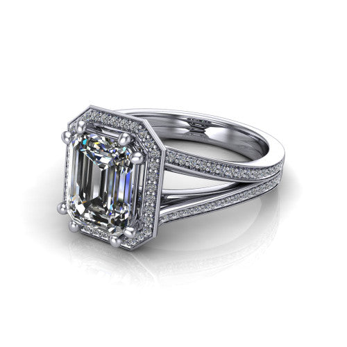 Lyra emerald halo engagement ring in 18K White Gold, three-quarter perspective showing the step-cut emerald center diamond inside a squared pave halo on a pave split shank