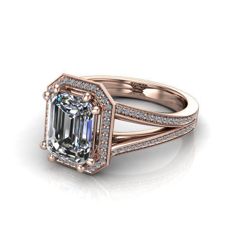Lyra emerald halo engagement ring in 18K Rose Gold, three-quarter perspective showing the step-cut emerald center diamond inside a squared pave halo on a pave split shank