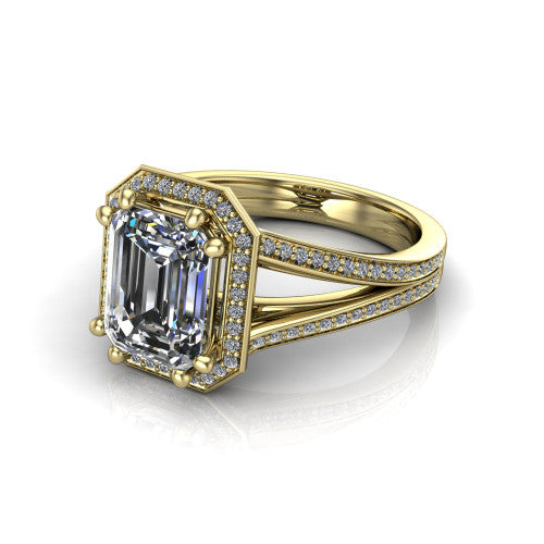 Lyra emerald halo engagement ring in 14K Yellow Gold, three-quarter perspective showing the step-cut emerald center diamond inside a squared pave halo on a pave split shank