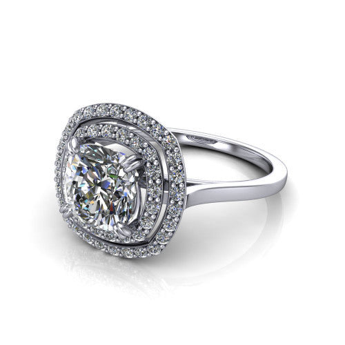 Gwendolyn cushion halo engagement ring in Platinum, three-quarter perspective showing the brilliant cushion-cut center diamond framed by two pave diamond halos and a polished knife-edge shank