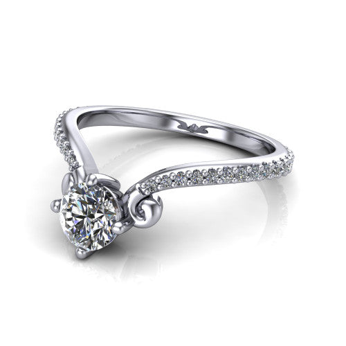 Aveline round solitaire engagement ring in 14K White Gold, three-quarter perspective showing the round center diamond above a chevron pave band with scroll shoulders