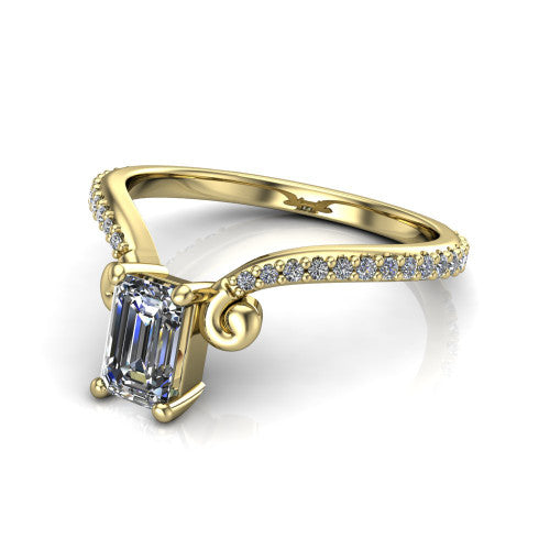 Aveline emerald solitaire engagement ring in 14K Yellow Gold, three-quarter perspective showing the emerald center diamond above a chevron pave band with scroll shoulders