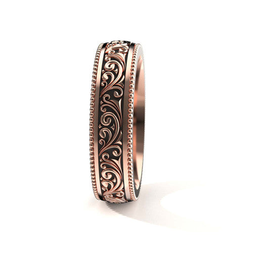 Elegant 14K rose gold men's wedding band featuring intricate scrollwork and engraved edges