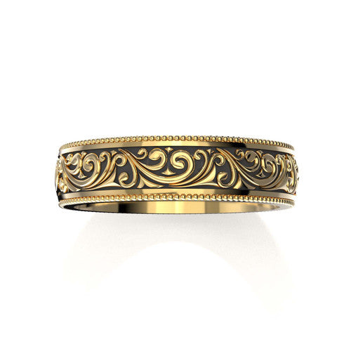 Unique men's wedding band in yellow gold with engraved details and classic scrollwork
