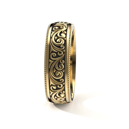 Elegant 14K yellow gold men's wedding band featuring intricate scrollwork and engraved edges