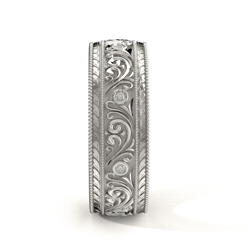 Handcrafted men's white gold wedding band featuring scrollwork designs, engraved borders, and natural diamonds