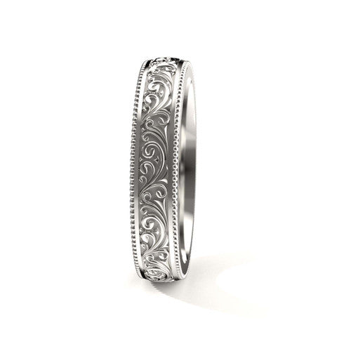 Vintage-style 14K white gold men's wedding band featuring intricate scrollwork and engraved edges