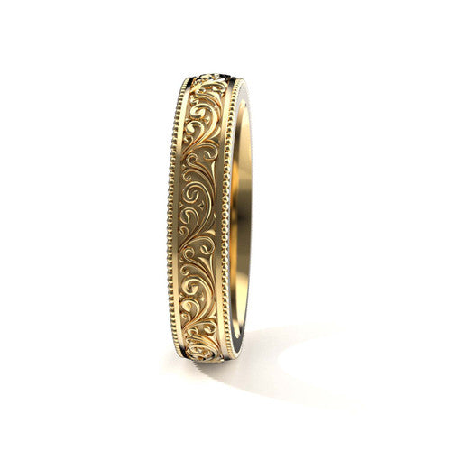 Vintage-style 14K yellow gold men's wedding band featuring intricate scrollwork and engraved edges