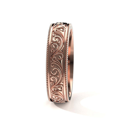 Handcrafted men's rose gold wedding band featuring detailed scrollwork and vintage-inspired design