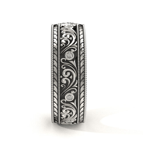 Handcrafted men's white gold wedding band featuring intricate scrollwork, engraved borders, and natural diamonds